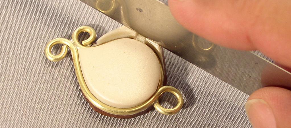 Condition the pearl-colored polymer clay (How-Tos).
