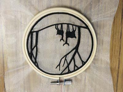 Lay piece "a" face up over the inner hoop of the hand embroidery hoop.
