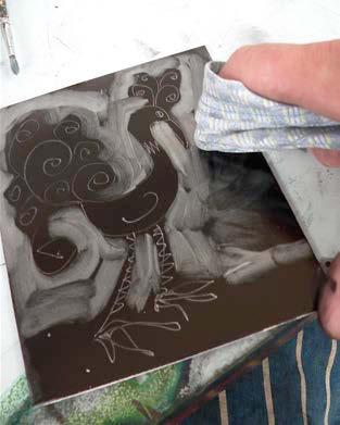 Roll out a thin and even layer of printing ink to cover the whole plate. 3.
