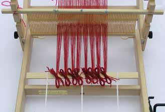 Threader for the size 12 heddle (a 3 inch nylon loop for dental flossing you can find at a drug store) Tying Your Warp Some threads can simply be poked through the hole.