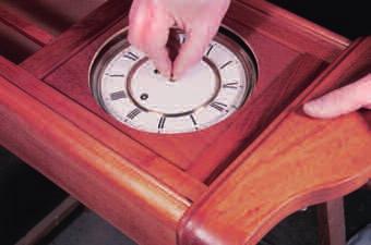 Gently reposition the movement until the dial is centered in the cutout (see photo, below).