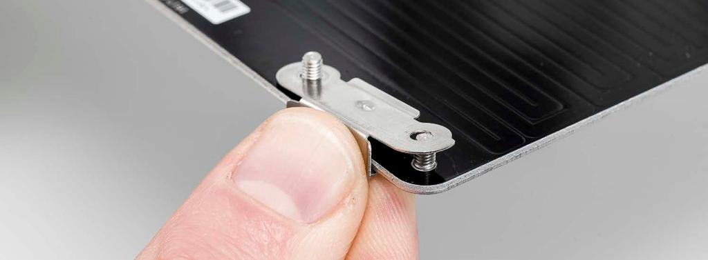 Using pliers or a socket wrench, secure the clamps to the bed with two lock nuts each. 2.