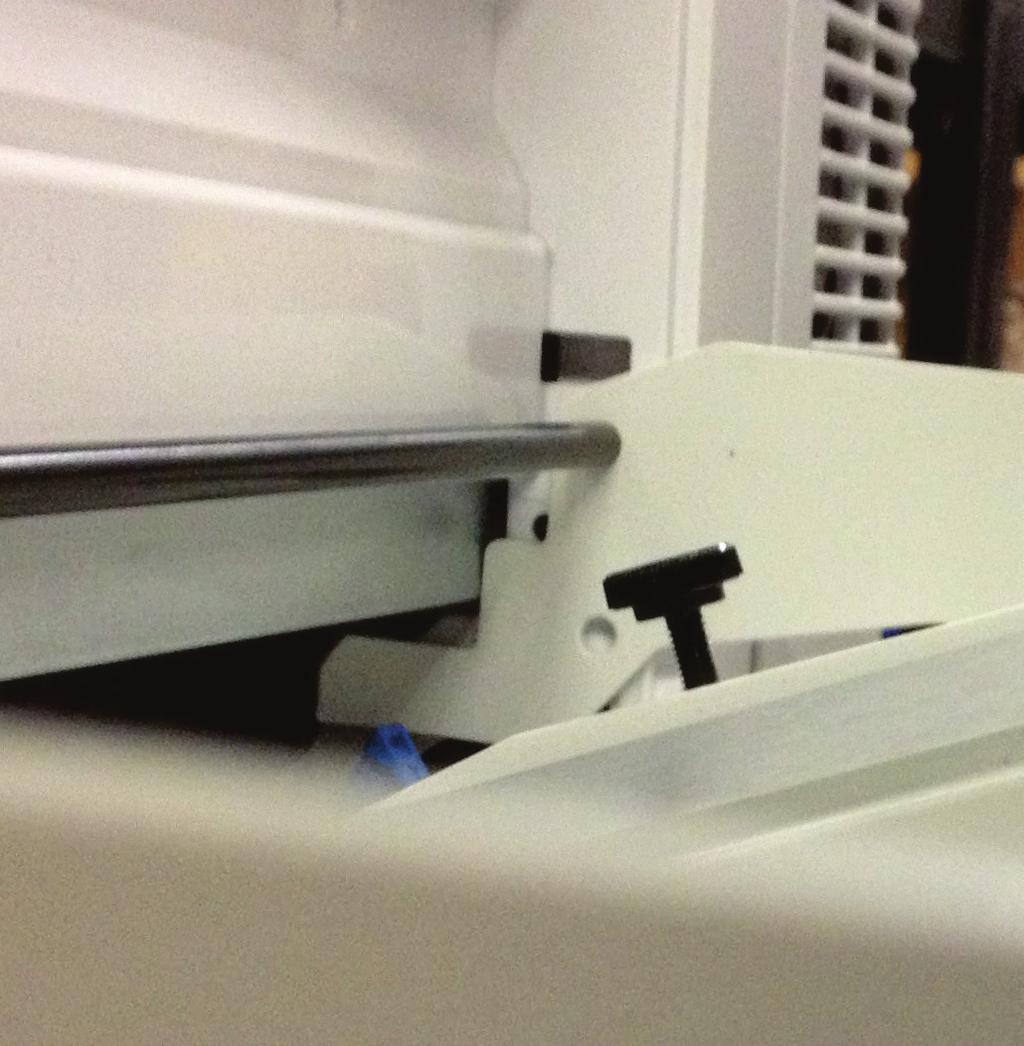 Ensure that the feeder can be pushed in far enough for the side plates to be up against the printer body as shown here: NOTE: If you cannot push