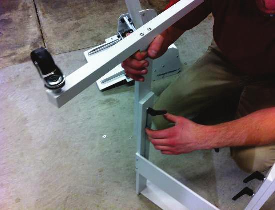 Tighten the locking levers to hold leg in this position. Locking levers should be on inside of stand.