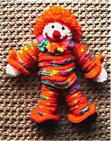 SECTION 6 Yo-Yo Clown Materials: About 4 ounces of a bright-colored worsted weight acrylic yarn (I used Red Heart Kids variegated color "Bikini") Small amount of white yarn, red yarn and black