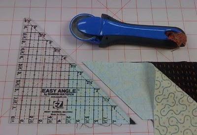 Unit 2! Half-Square Triangles! I use the Easy Angle ruler A LOT for half square triangles. The biggest benefit is that it works with the sizes of scrap strips that I already keep on hand.