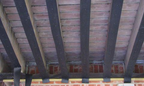 The Bib may be stapled to the inside face of the beam. The two edges of the Bib wrap around and attach to the inside face of the two joists that form the bay.