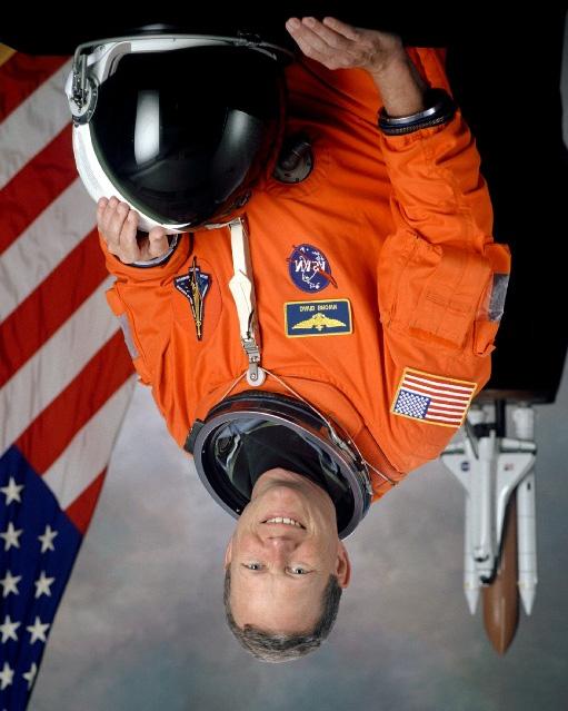 Mission Specialist 1: David M. Brown David M. Brown, 46, a captain in the U.S. Navy, is a naval aviator and flight surgeon. He will serve as Mission Specialist 1 for STS-107.