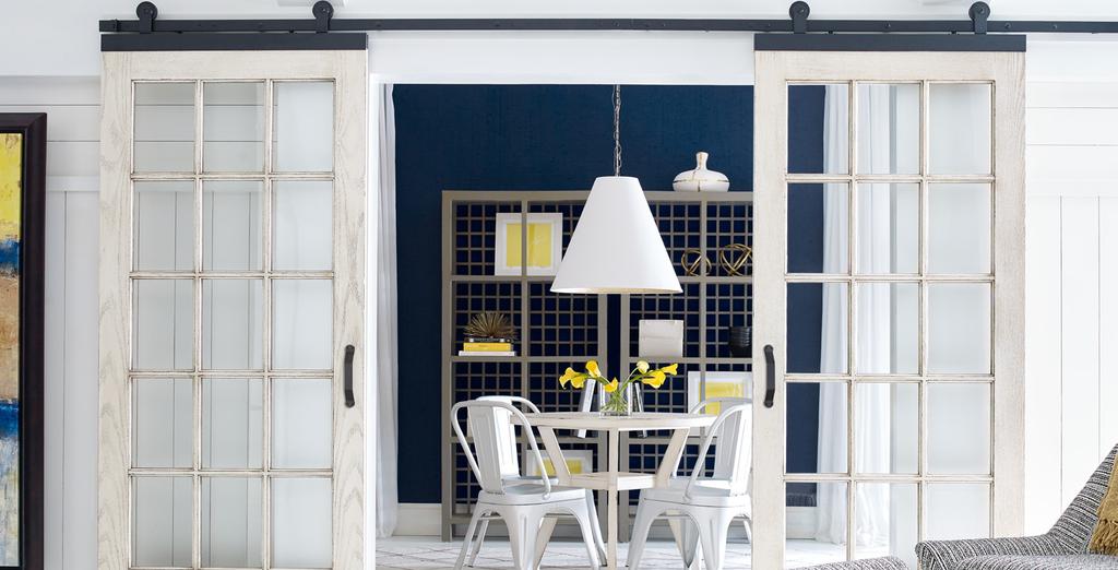 Barn Doors Deliver Style and Function Barn doors have made their way from the barn to statement pieces in many homes. Barn doors offer both style and function.