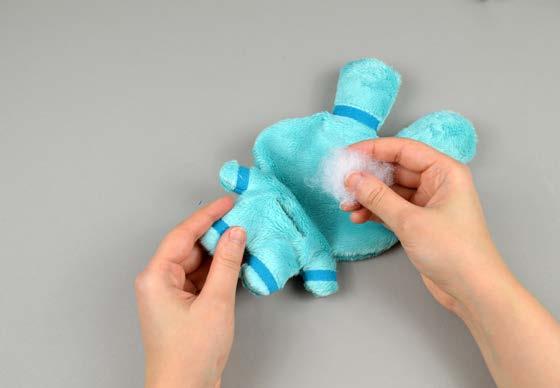 6. stuff and shut the plush Stuff the plush a bit at a time. Start with small balls to fill the arms, legs, and ears.