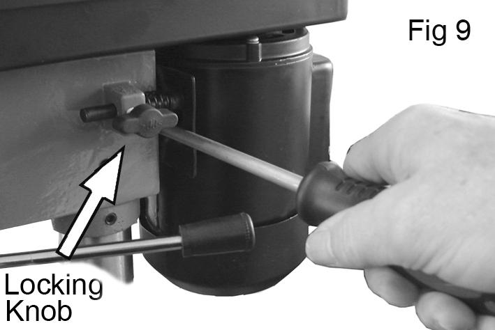 3. Lever the motor/bracket, away from the head, so that tension is applied to the belt. 4. Lock the motor in this position using the locking knob.