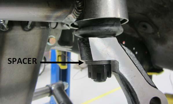 13) The next step is to bolt down the upper ball joint to the top of the spindle.