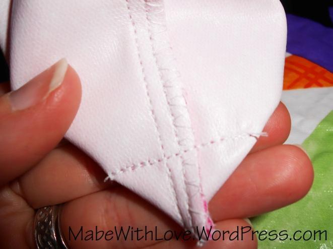 23. Sew a short straight stitch across the pinched corner as pictured