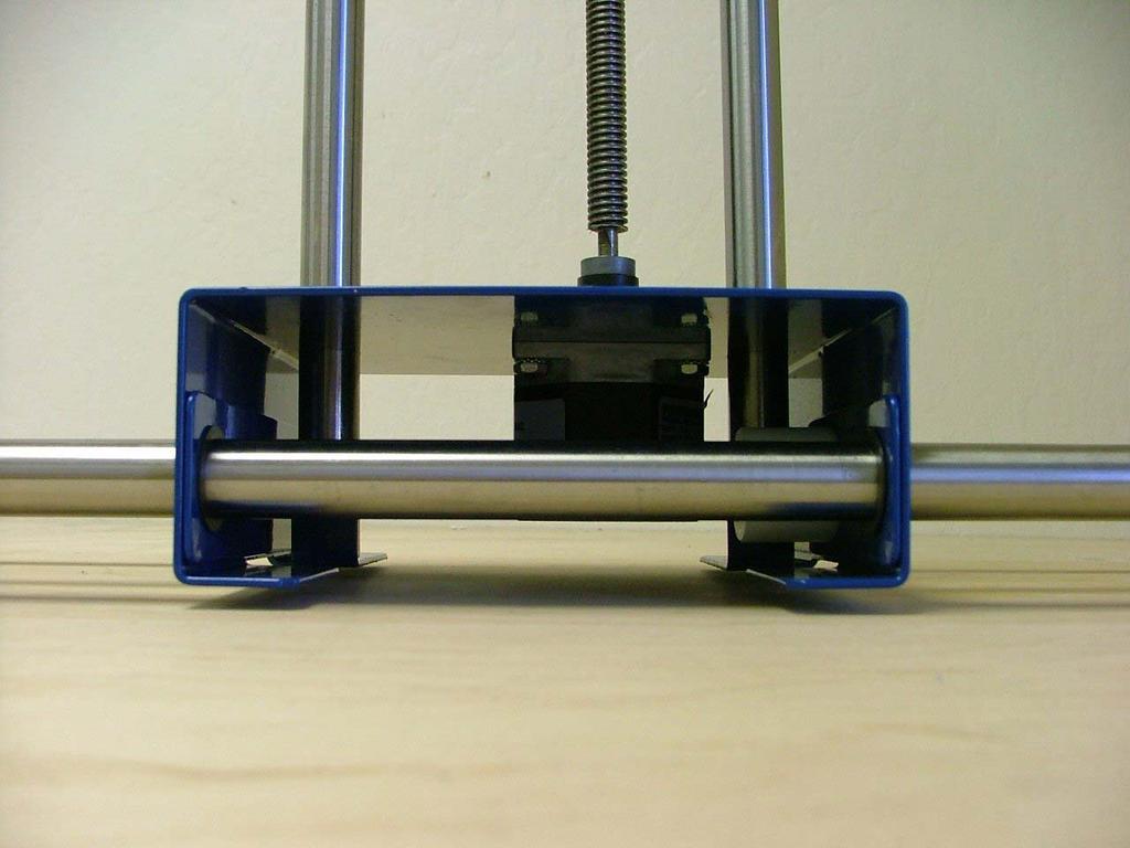 Side view of the Y-axis slide mounted on top of the X-axis carriage.
