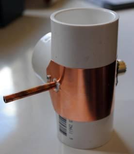 Use a short length of ¼ inch copper tubing to follow thru the PVC T for stability of the connection.