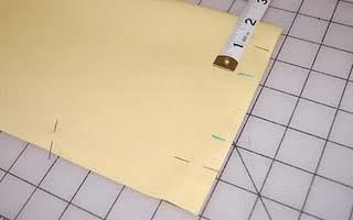 Fold the long rectangle in half lengthwise, matching the exterior