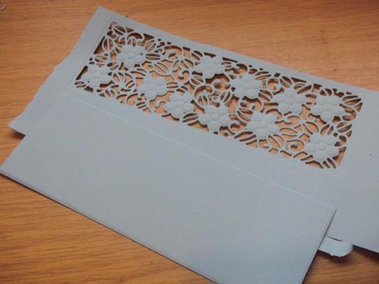 small strip of matching card ( 6cms x 2cms ) placed on the inside fold to match it the same depth as the