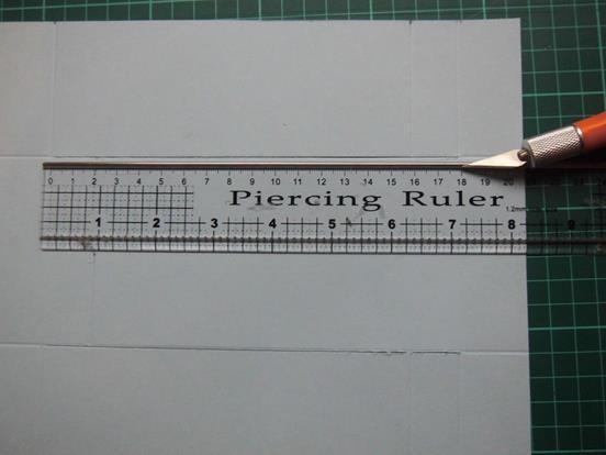 Place the card onto a craft cutting mat & cut on both the 60mm side channels starting from measurement D to the measurement F ONLY.