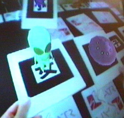 3 SAMPLE INTERFACES We have tested the Tangible AR approach in a variety of prototype interfaces, including; Shared Space: A collaborative game designed to be used by complete novices, AR PRISM: An