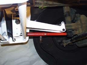 Step 12 Using a Porta-Power or C-clamp apply force to the bottom portion of the Spring Carrier to