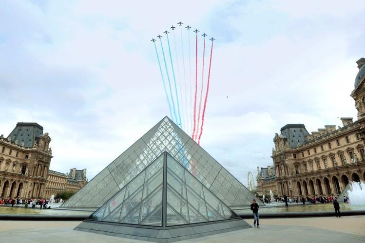 French Air Force jets fly over the Louvre in Paris during Bastille Day celebrations on July 14, 2014. AGENCE FRANCE-PRESSE/GETTY IMAGES Mr.