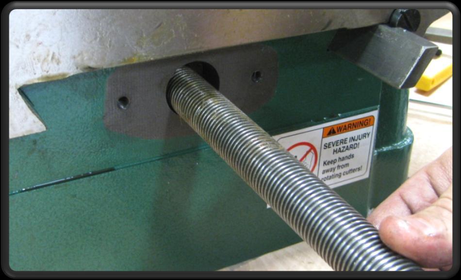 ) 10) Slide the table saddle assembly to the front edge of the machine (away from spindle