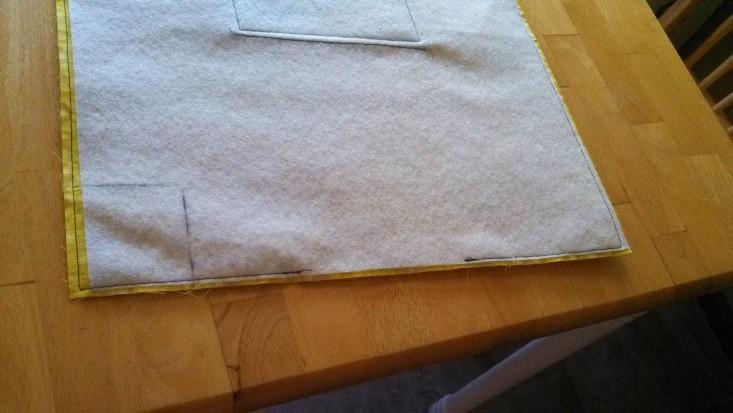 Lay the lining panel flat and draw a 3" square on both sides of each