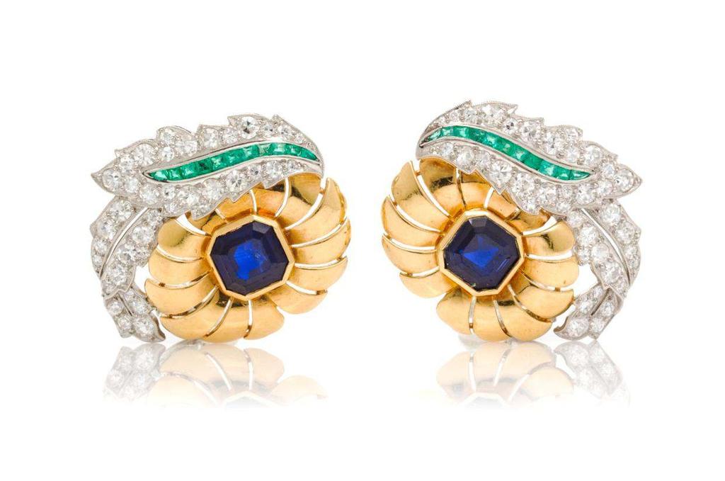 Sale 394 Lot 156 A Pair of Platinum, Yellow Gold, Sapphire, Emerald and Diamond Earclips, Raymond Yard, in a stylized foliate motif composed of sculpted yellow gold blossoms accented with platinum
