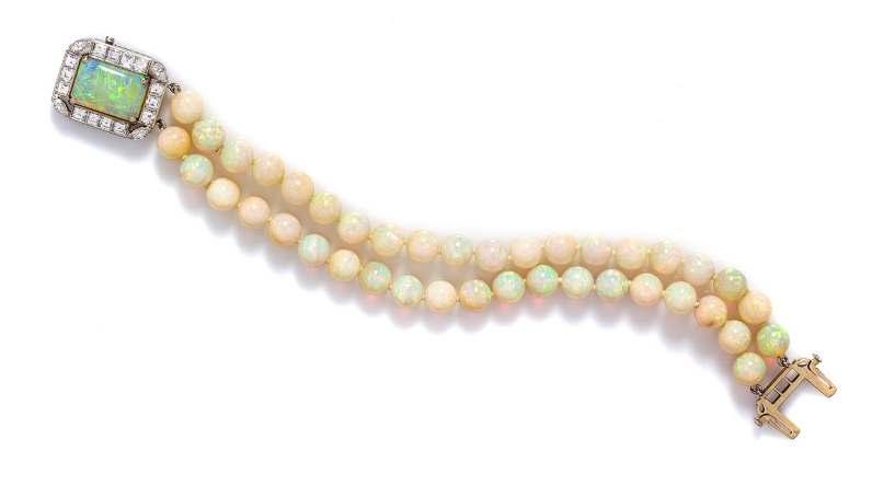 Sale 394 Lot 157 An Platinum, Gold, Opal and Diamond Bracelet, Raymond Yard, consisting of a double strand of 40 white and semi-crystal opal beads measuring approximately 7.00-7.