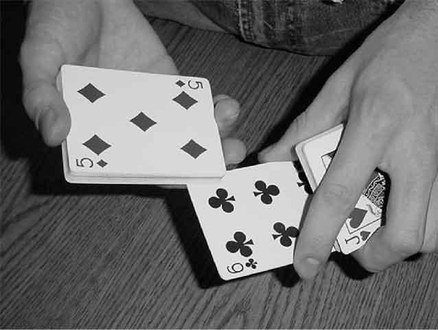 Move your thumb forward as your fingers move backward, this will fan the cards and is the basic Thumb Fan.