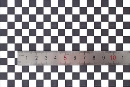 2) esign and manufacture of a checkerboard pattern which is large enough to cover the shooting region, shows as Fig. (a).