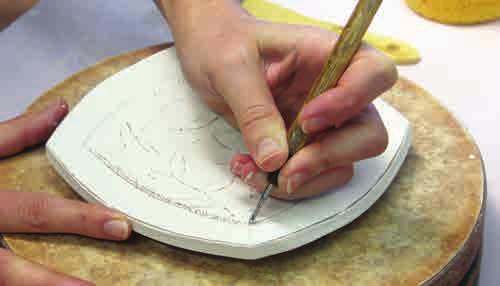 5. Apply 1 2 coats of underglaze then gently scrape underglaze off the raised slip-trailed lines. 6. Carve subtractive lines into the plate using a sgraffito tool or sharp pointed tool. 7.