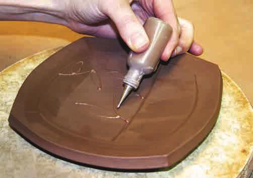 Rotate the plate and gently lift all four sides. 4. Use a slip from your clay body to create a raised line with a slip trailer. Allow the lines to dry before applying underglaze. ⅜ ½ inch.
