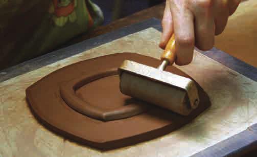 Applying the Foot Place the stencil onto the cut out slab and trace the interior ring with your needle tool.