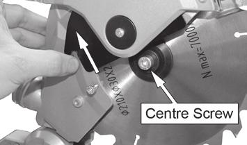 The maximum rotation speed of the tool must not exceed that of the saw blade. 1. With the saw head in the raised position, Loosen the cover screw shown. 2.