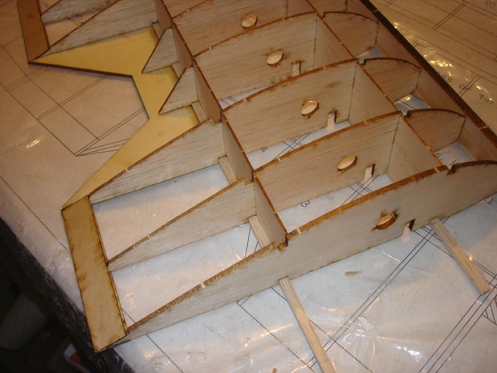 The ailerons are formed by a laser cut sheet of balsa and reinforced with small riblets. Mount 4-40 blind nuts in 1/8" Plywood mounts for wing attachment points.