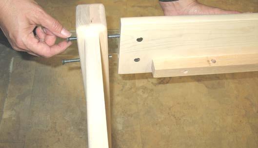 From the back of the headboard, thread a bolt through each hole in the headboard into the corresponding hole in the side rail so that it screws into the barrel nut placed in the rail in step #13.