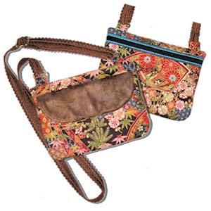 The Katey An in-the-hoop project An over-the-shoulder/cross-body purse with 3 pockets. Back pocket is zippered and full length of the purse. Middle pocket is open.