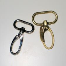 Gate Clips. Come in several sizes and are great for removable purse straps. Special Precautions You will be hooping only the stabilizer. It needs to be tight in the hoop with no slippage.