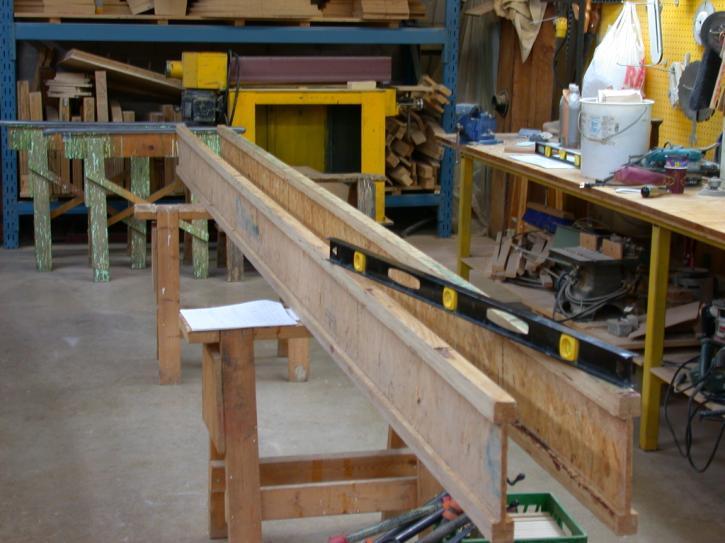 CONSTRUCTION PROCEDURES: (A) Set up the two I-BEAMS on a pair of sawhorses. Place them side by side (not separated as in photo) and do the layout of the gusset lines as in the next diagram.