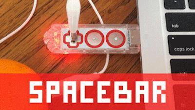To switch between "mouse left-click" and "space bar," tap the Gear Button on the Makey Makey GO. This will turn the light Red.