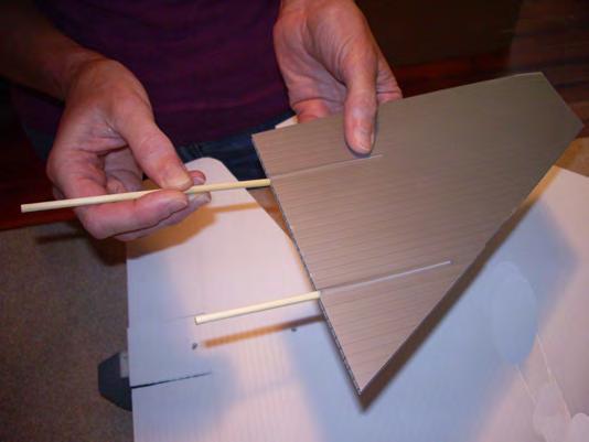 Epoxy 2 dowels into the flutes of each vertical stabilizers.