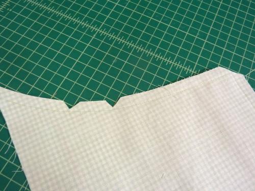 12. Press open the seam allowance. 13. Turn the bib right side out through the open bottom.