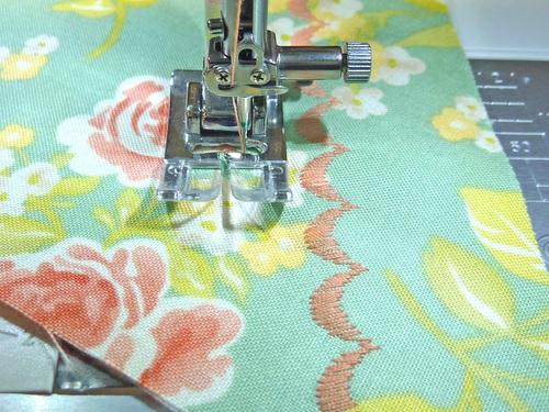 Re-set the machine for a decorative stitch to exactly match what you used on the bib. 4. On the pockets, the rows of decorative stitching are parallel with the slanted top edge of the pocket.