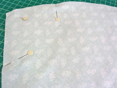15. Find the skirt lining panel. Place the lining panel right sides together with the exterior panel, sandwiching the pockets between the layers.