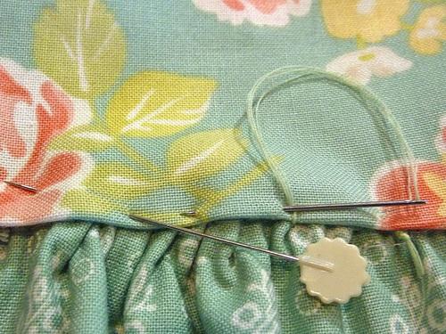 20. Remove any visible gathering stitches and press flat. Make and attach the ties 1. Find the eight fabric tie strips and the four matching interfacing strips. 2.