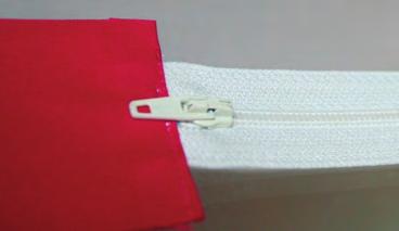 Pin in place. Topstitch the fabric to the zipper as shown.