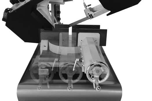 Loosen the vise slide lock (see Figure 28). 4. Slide the vise to the right until it stops. Cuts to the Right 1. DISCONNECT BANDSAW FROM POWER! 2. Loosen the lock handle shown in Figure 28, then swivel the headstock to the desired angle, using the angle scale as a guide.