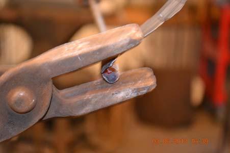 You can clamp the stem in a vise, hold the petal strip with tongs and pull while circling your vise.