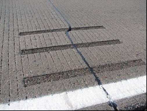 transverse mid-panel cracks. The two prominent performance measures to examine are the crack faulting and loadtransfer efficiency.